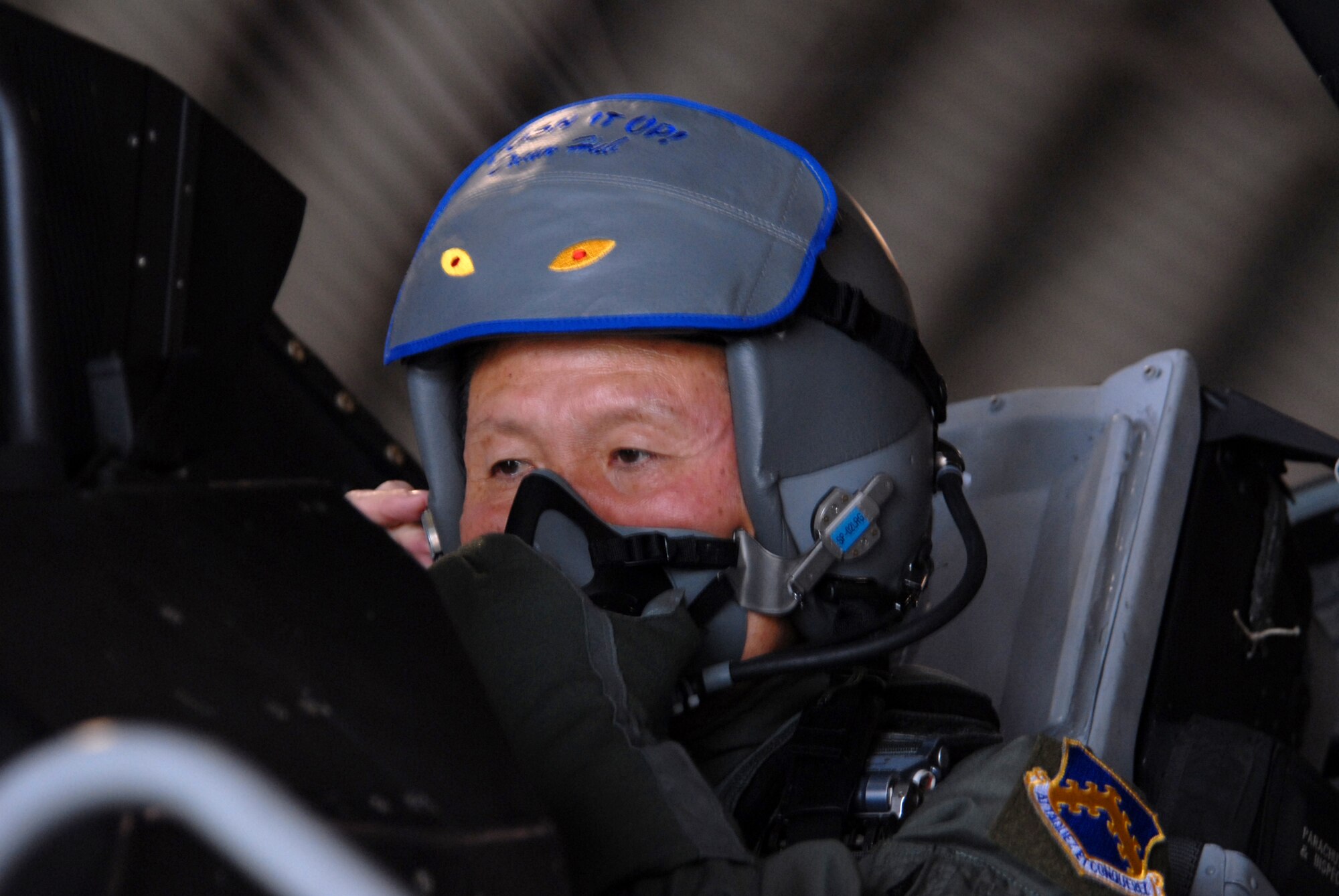Gunsan City Mayor Dong Shin Moon prepares for his high-speed taxi ride in the back of an F-16 at Kunsan Air Base, Republic of Korea Sept. 23. Mayor Moon was participating in the Pilot for a Day program which is part of USFK's Good Neighbor Program.(U.S. Air Force photo by: Senior Airman Angela Ruiz)