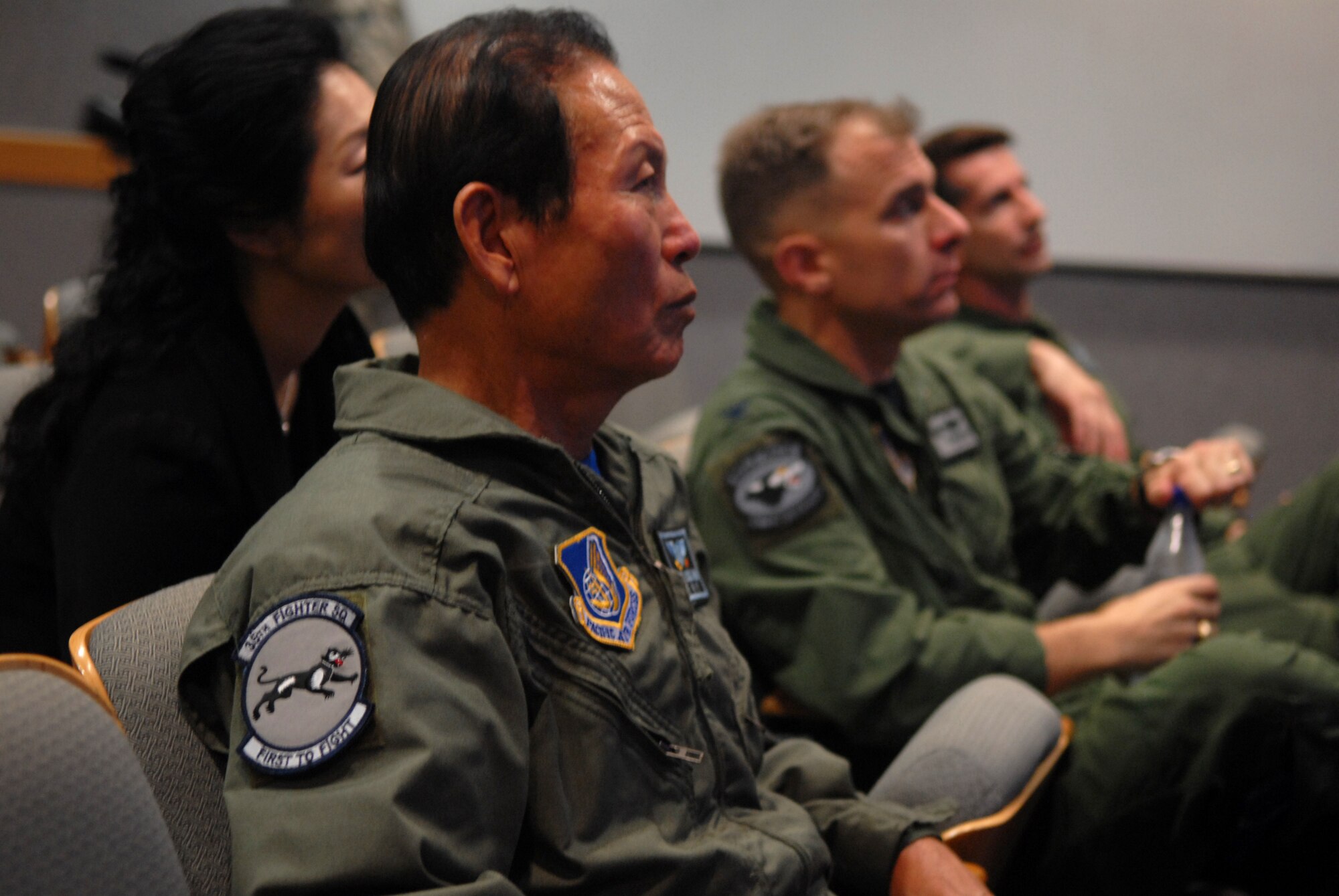 Gunsan City Mayor Dong Shin Moon, Col. Bryan "Wolf" Bearden, 8th Fighter Wing commander, and Lt. Col. Steven Kennel, 35th Figher Squadron commander, receive their flying briefing prior to the Mayor's high-speed taxi ride at Kunsan Air Base, Republic of Korea, Sept. 23. Mayor Moon was participating in the Pilot for a day which is part of the Good Neighbor Program.(U.S. Air Force photo by: Senior Airman Angela Ruiz)