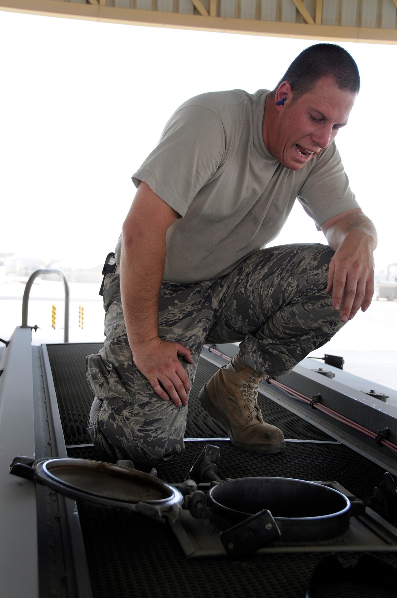 Staff Sgt. Jeremy DuBose, 379th Expeditionary Logistics Readiness Squadron, reports tank fuel levels during a test of the high-level sensor in a fuel truck Sept. 22, 2008.  The truck has been reported as having a problem with the sensor that cuts off the flow of fuel as it reaches a maximum height within the fuel tank at this undisclosed air base in Southwest Asia.  To check the sensor a set amount of fuel is pumped out of the truck, and then the automatic system pumps fuel in until the fuel reaches the sensor and automatically shuts off the flow of fuel into the tank.  If the amount of fuel pumped out equals the amount pumped in before sensor shut off, the sensor is working properly.  Sergeant Dubose, a native of Kingston Tenn., is deployed from Shaw Air Force Base, S.C., in support of Operations Iraqi and Enduring Freedom and Joint Task Force-Horn of Africa.  (U.S. Air Force photo by Tech. Sgt. Michael Boquette/Released)