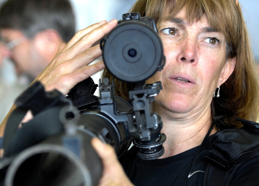 Dr. Maggie O'Brien, President of St. Mary's College in Maryland and a  participant in the 76th Joint Civilian Orientation Conference, views the sights of a military rocket launcher during a tour on the USS Iwo Jima in Souda Bay, Greece, Sept. 21, 2008. The JCOC participants are on a seven-day trip through the European Command. JCOC is the longest running Department of Defense outreach program used to explain to American business and community leaders what the Defense Department does. 