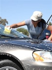 2nd Lt. Janette Miquel, Flight Nurse, 349th Aeromedical Evacuation Squadron, washes cars to raise funds for the 2008 Wing Enlisted Workshop. The workshop is scheduled for Sep. 16-18 at the Aerial Port Squadron here. Enlisted personnel interested in attending should coordinate with their supervisor or first sergeant for more information. 