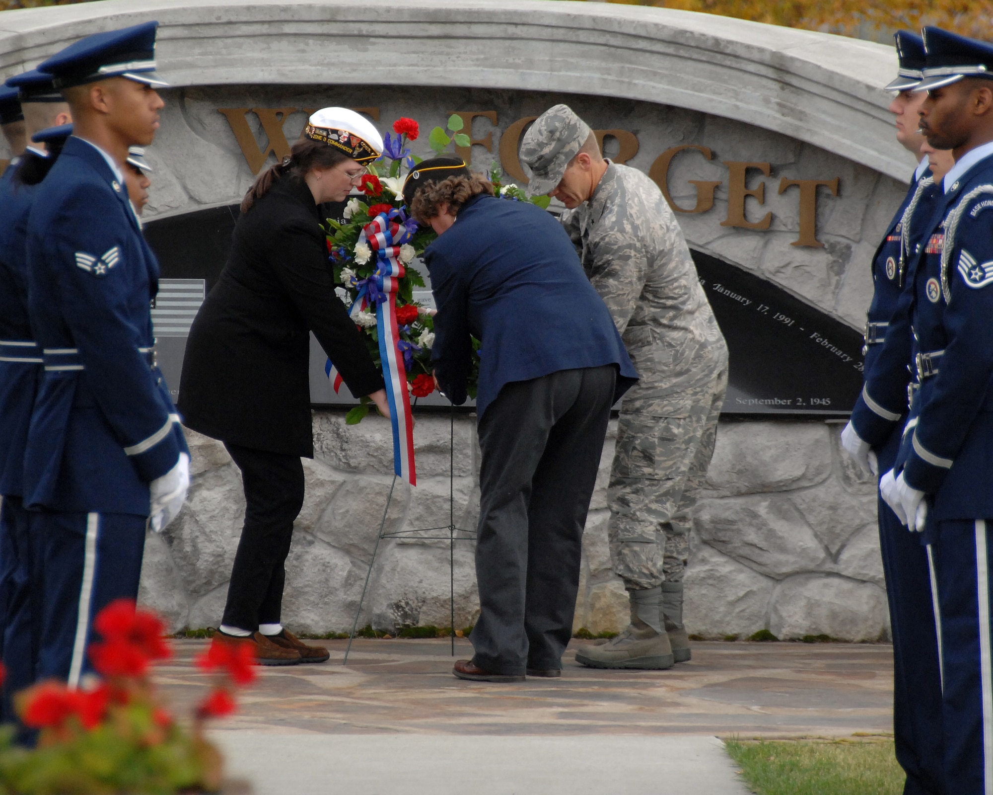 Brig. Gen. Mark W. Graper and distinguished guests lay a wreath Sept. 19, 2008 at Heritage Park on Eielson Air Force Base. The POW/MIA ceremony takes place to recognize the prisoners of war and military members labeled missing in action in past wars. (U.S. Air Force photo by Airman 1st Class Willard E. Grande II)
