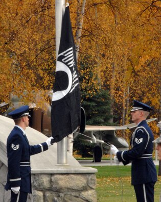 Members of Eielson Air Force Base honor guard lower the POW/MIA flag in remembrance Sept. 19, 2008 at Heritage Park on Eielson Air Force Base. The POW/MIA ceremony takes place to recognize the prisoners of war and military members labeled missing in action in past wars. (U.S. Air Force photo by Airman 1st Class Willard E. Grande II)