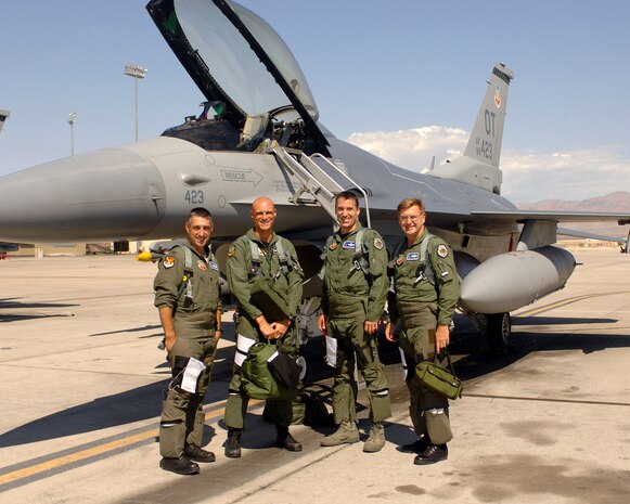 Lt. Col. David Thirtyacre, U. S. Air Force Warfare Center Deputy A3 (third from left), flew an F-16 sortie with Brig. Gen. Stephen L. Hoog, United States Air Force Warfare Center commander (far right), along with wingmen Col. Michael Schwamm, National Guard Bureau advisor (far left), and Squadron Leader Justin Helleiwell, 422nd Test and Evaluation Squadron UK exchange officer (second from left). The sortie took Lt. Col Thirtyacre over the 3,000-flying-hour mark in the F-16 Fighting Falcon. (U.S. Air Force Photo by SrA Jason Huddleston)