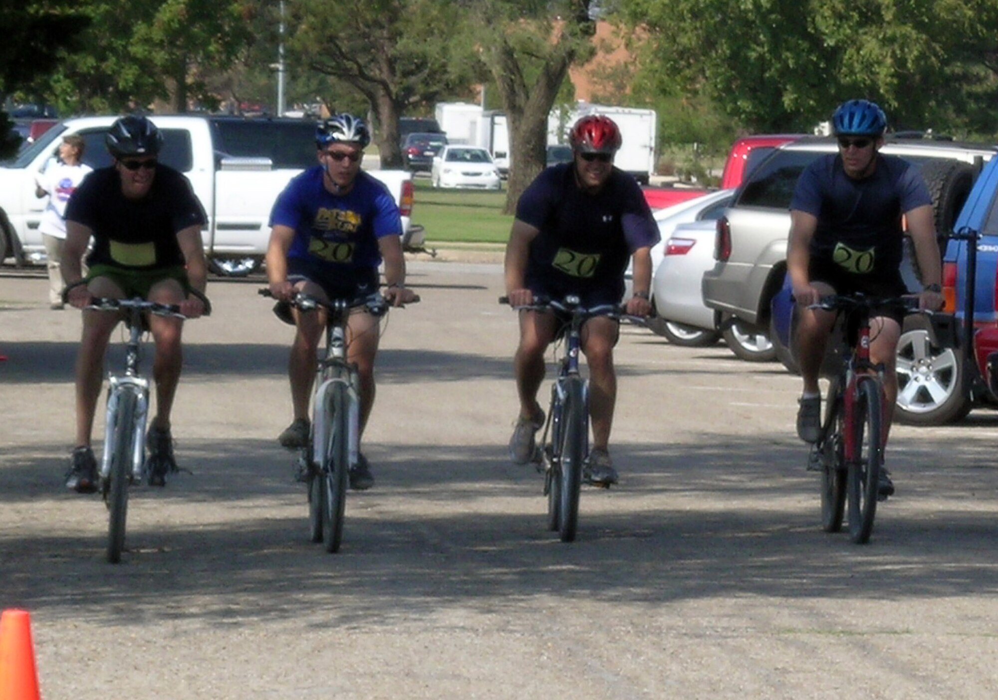 An Extreme Team entry, “The Front Office,” pushes to the finish line to take first place at the Vance AFB  2008 Adventure Race, Sept. 20. From left to right: Maj. Todd Dyer; 2nd Lt. Mark Fraser; Col. Mark Nowland, the 71st Flying Training Wing commander; and Capt. Joe Markowski. Their overall time for the four-mile run, two-mile raft paddle and 12-mile bicycle ride was 1:46:53. Extreme teams had to complete the entire race together. (U.S. Air Force photo by Sarah Putnam)