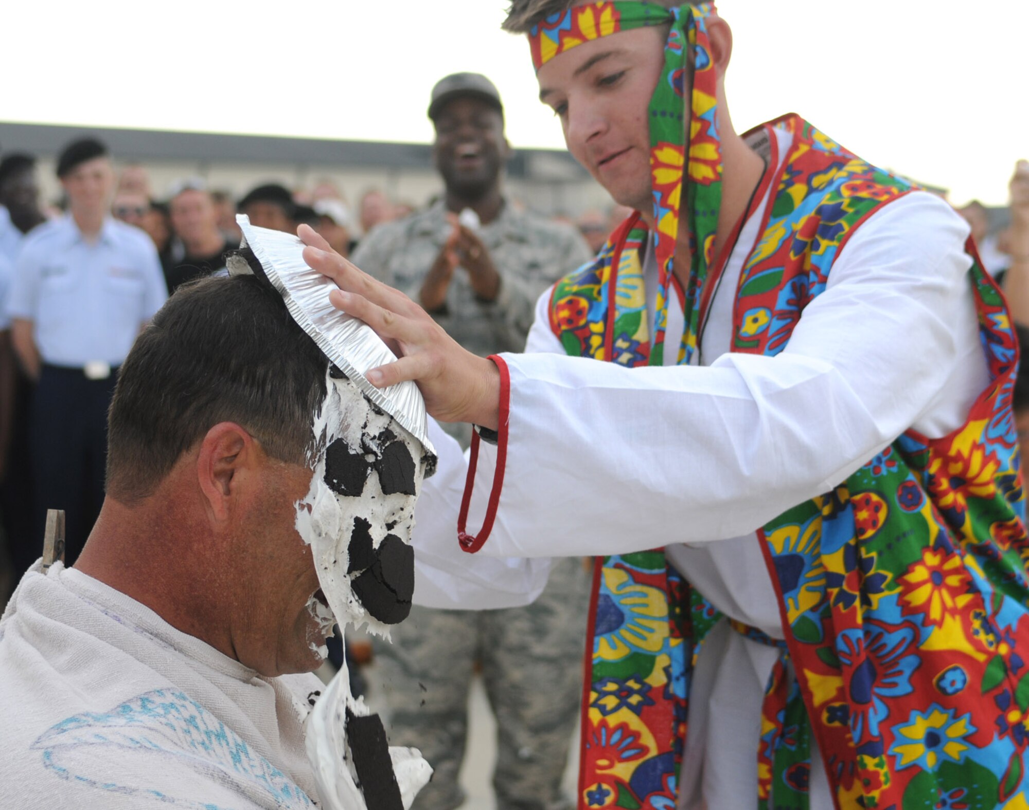 Master Sgt. Daniel Ransom, left, a military training leader in the 335th Training Squadron, gets a pie in the face from one of his unit’s students, Airman Mitchell Beckner, after Friday’s drill down.  The event was part of a fundraising effort for the American Red Cross undertaken by students in the 81st Training Group.  (U.S. Air Force photo by Kemberly Groue)