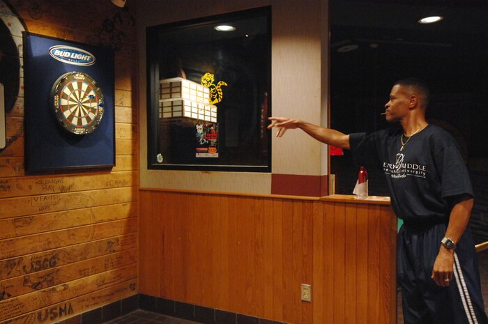 Master Sgt. Rodney Whitaker, U.S. Air Force Warfare Center at Nellis Air Force Base safety superintendent, NV.,  throws a darts during the Boss and Buddy dart tournament held at the Nellis Officers Club on Sept. 17, 2008.  The Boss and Buddy dart tournament was held in conjunction with Air Force Heritage Week celebrated during the week of the United States Air Force's birthday.  (U.S. Air Force photo/Senior Airman Brian Ybarbo)
