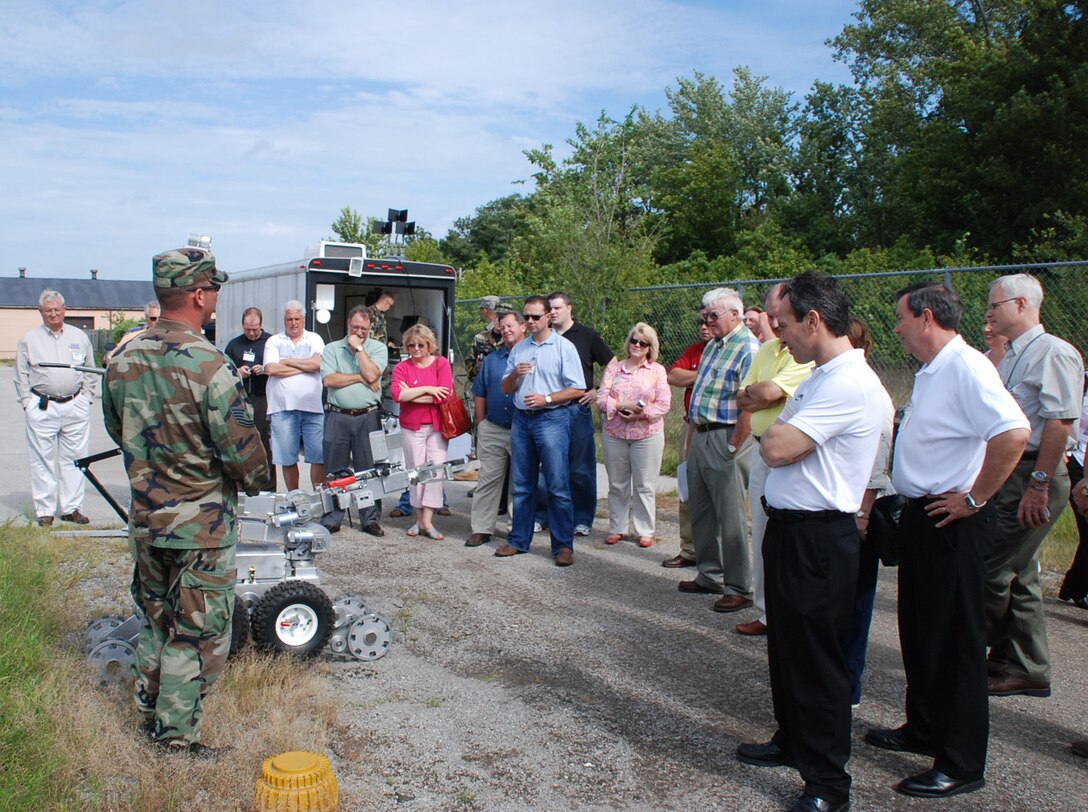 Learning about the 932nd Airlift Wing...These Boss Day tours are designed to help educate and inform the employers about the Air Force Reserve mission.  Robots and bosses met in an explosive ordnance disposal demonstration.  The 932nd Airlift Wing gave civilian employers of 932nd Airlift Wing Reservists a chance to see military life behind the scenes, and push a few explosive buttons. The explosive ordnance disposal team set up a demonstration of robotics and "charges" for the visitors. The commander and staff members gave briefings and a base tour was included. Photo/Tech Sgt. Gerald Sonnenberg  