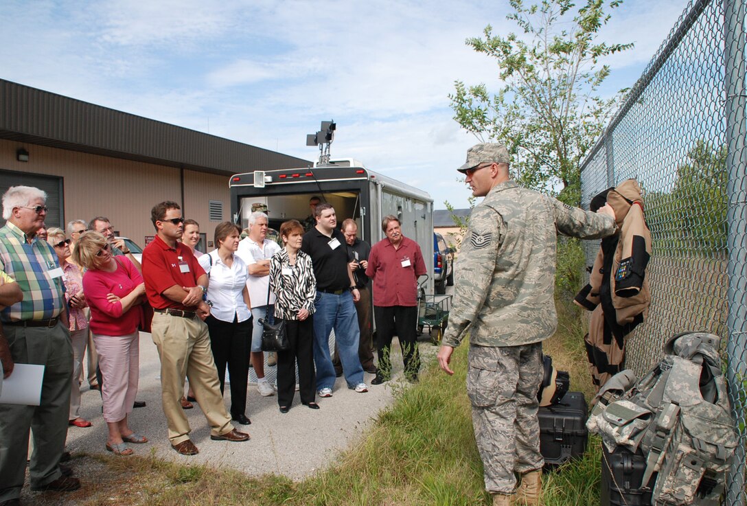 Learning about the Explosive Ordnance Disposal Specialist at the 932nd Airlift Wing...The Boss Day 2008 was designed to help educate and inform the employers about the Air Force Reserve mission.  The 932nd Airlift Wing gave civilian employers of 932nd Airlift Wing Reservists a chance to see military life behind the scenes as this sergeant shows off a protective suit. The explosive ordnance disposal team set up a demonstration of robotics and "charges" for the visitors. The commander and staff members gave briefings and a base tour with the dogs was included. Photo/Tech Sgt. Gerald Sonnenberg