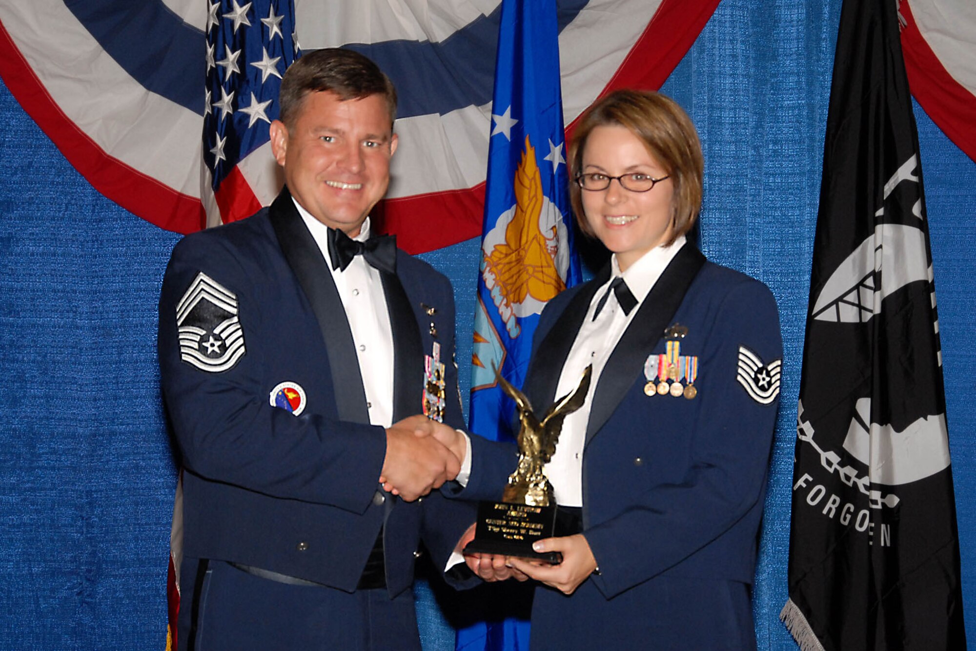 CMSgt Dennis R. Norman, Commandant, AF Senior NCO Academy presents the Levitow Award to TSgt Sherry Burt
