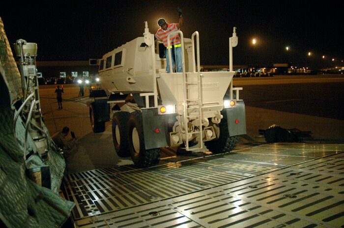 Airmen load a mine-resistant ambush-protected vehicle onto a C-5 Galaxy Aug. 16, 2007, at Charleston Air Force Base, S.C. The C-5 is assigned to the 436th Airlift Wing Dover AFB, Del. (U.S. Air Force photo/Staff Sgt. April Quintanilla) 