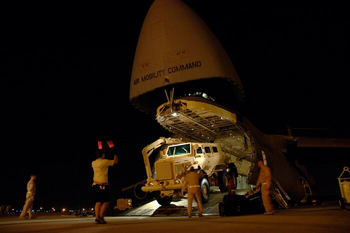 Airmen load a mine-resistant ambush-protected vehicle onto a C-5 Galaxy Aug. 16, 2007, at Charleston Air Force Base, S.C. The C-5 is assigned to the 436th Airlift Wing Dover AFB, Del. (U.S. Air Force photo/Staff Sgt. April Quintanilla) 