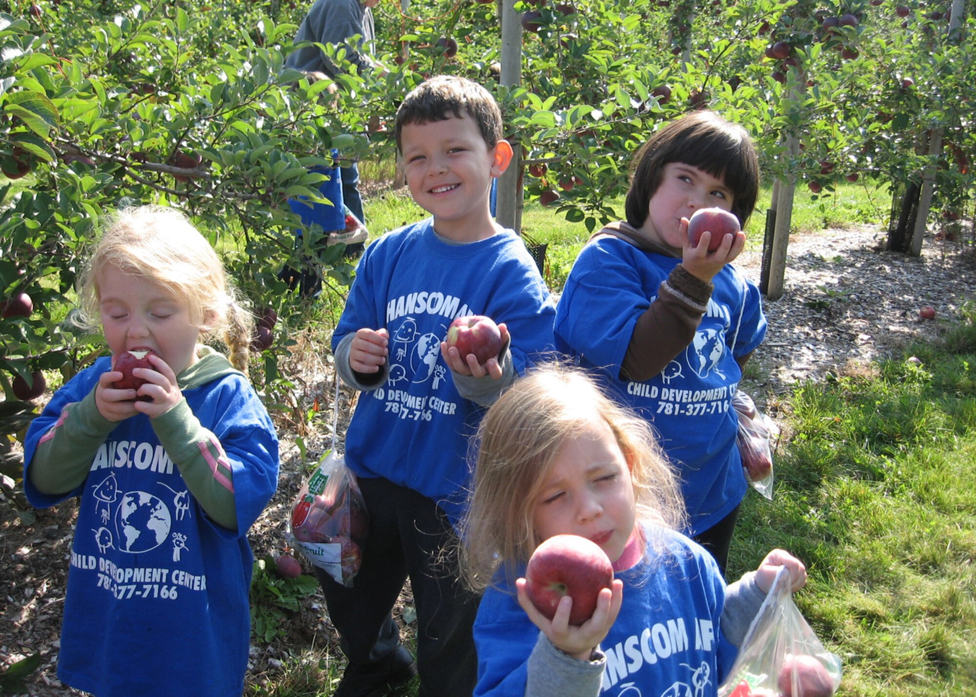 HANSCOM AFB, Mass. -- Hanscom children enjoy the fruits of their labor during a Child Development Center field trip to an apple orchard in Tyngsboro, Mass., Sept. 24. (U.S. Air Force photo by Rhonda Siciliano)