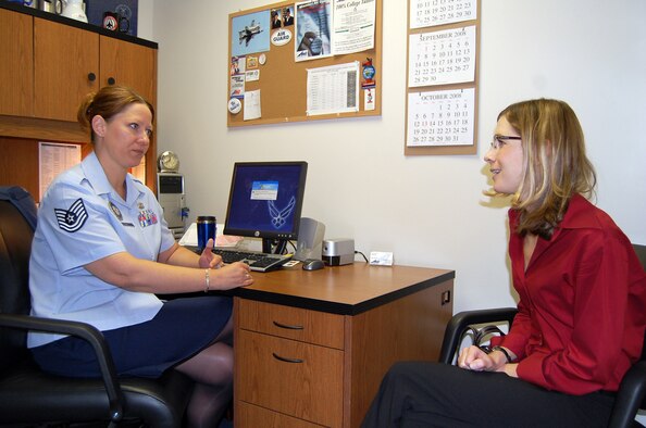 Tech. Sgt. Jenifer Kuhl, 131st Mission Support Flight DPMR officer recruiter, explains to Jennifer Weier, potential officer candidate, the process she would go through to become an officer.  Sergeant Kuhl is working primarily with civilians and servicemembers looking to become officers. (Photo by Airman 1st Class Jessica Donnelly)