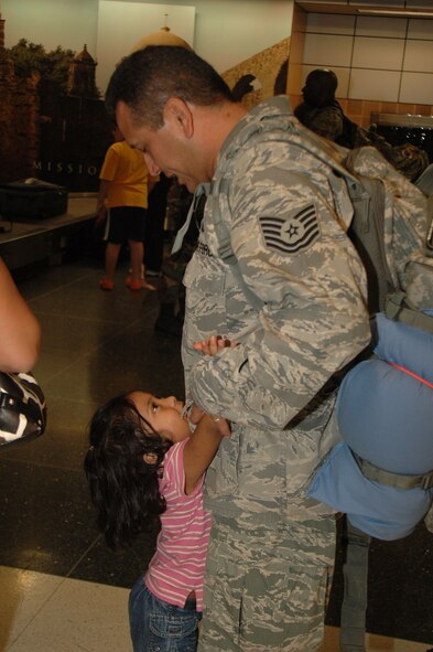 After six months in Afghanistan, member of the 433rd Civil Engineer Squadron returned home on Sept 22, 2008. Family and friends met them at San Antonio Airport with banners, cheers and even a few happy tears were shed during the reunion. The Alamo Wing engineers spent their deployment building and repairing structures at Bagram Airfield and several forward operating locations. They installed air conditioning units for Soldiers, brought older buildings up to U.S. Military construction codes and built brand new facilities. The group joined up with members of the Niagara Falls Air Force Reserve unit to create the first Prime BEEF, or Prime Base Emergency Engineer Force, team to operate in the country in almost two years.  (U.S. Air Force Photo/Master Sgt. Daniel Nathaniel)
