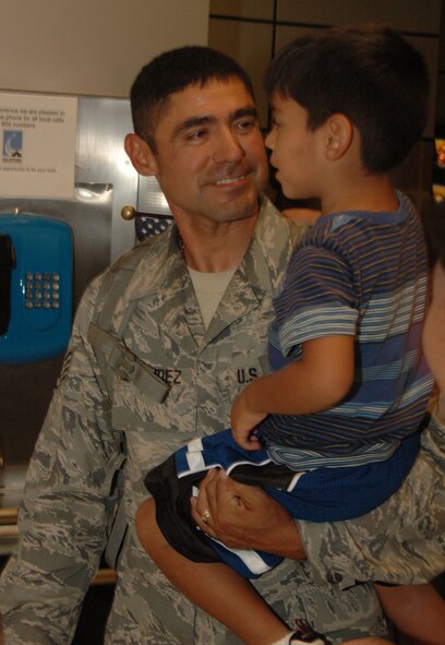After six months in Afghanistan, member of the 433rd Civil Engineer Squadron returned home on Sept 22, 2008. Family and friends met them at San Antonio Airport with banners, cheers and even a few happy tears were shed during the reunion. The Alamo Wing engineers spent their deployment building and repairing structures at Bagram Airfield and several forward operating locations. They installed air conditioning units for Soldiers, brought older buildings up to U.S. Military construction codes and built brand new facilities. The group joined up with members of the Niagara Falls Air Force Reserve unit to create the first Prime BEEF, or Prime Base Emergency Engineer Force, team to operate in the country in almost two years.  (U.S. Air Force Photo/Master Sgt. Daniel Nathaniel)
