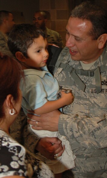 After six months in Afghanistan, member of the 433rd Civil Engineer Squadron returned home on Sept 22, 2008. Family and friends met them at San Antonio Airport with banners, cheers and even a few happy tears were shed during the reunion. The Alamo Wing engineers spent their deployment building and repairing structures at Bagram Airfield and several forward operating locations. They installed air conditioning units for Soldiers, brought older buildings up to U.S. Military construction codes and built brand new facilities. The group joined up with members of the Niagara Falls Air Force Reserve unit to create the first Prime BEEF, or Prime Base Emergency Engineer Force, team to operate in the country in almost two years.  (U.S. Air Force Photo/Master Sgt. Daniel Nathaniel)
