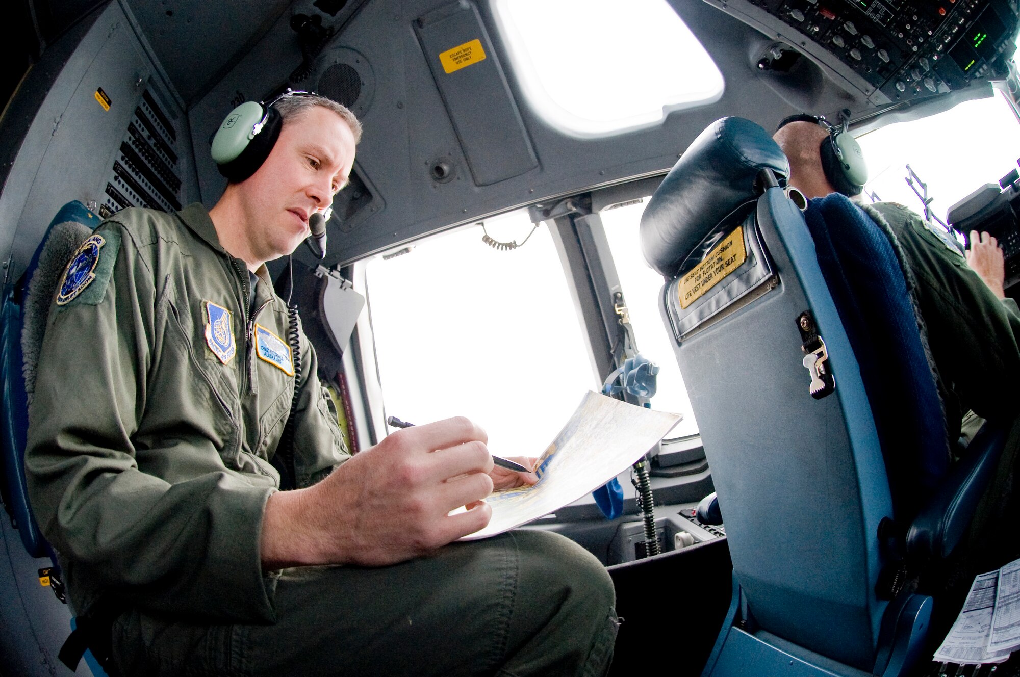 ELMENDORF AIR FORCE BASE, Alaska -- Lt. Col. Charles Fitzgerald, 249th Airlift Squadron, decipher a map of Alaska's terrain Sept. 23. Colonel Fitzgerald is a C-17 Globemaster III pilot for the Alaska Air National Guard. (U.S. Air Force photo/Senior Airman Jonathan Steffen)