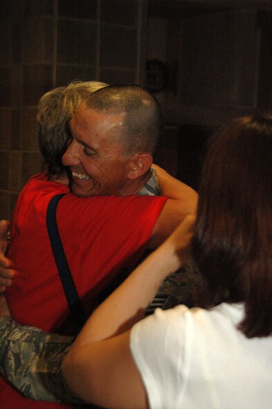 After six months in Afghanistan, member of the 433rd Civil Engineer Squadron returned home on Sept 22, 2008. Family and friends met them at San Antonio Airport with banners, cheers and even a few happy tears were shed during the reunion. The Alamo Wing engineers spent their deployment building and repairing structures at Bagram Airfield and several forward operating locations. They installed air conditioning units for Soldiers, brought older buildings up to U.S. Military construction codes and built brand new facilities. The group joined up with members of the Niagara Falls Air Force Reserve unit to create the first Prime BEEF, or Prime Base Emergency Engineer Force, team to operate in the country in almost two years.  (U.S. Air Force Photo/Master Sgt. Daniel Nathaniel)
