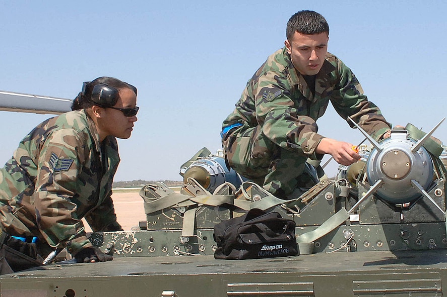 DYESS AIR FORCE BASE, Texas -- Airman 1st Class Rene` Romero, from the 7th Aircraft Maintenance Squadron, performs an inspection on the Guided Bomb Unit-31 (GBU-31), while Staff Sergeant Anitra Rosa, also from the 7th AMXS, ensures that the inspection is done properly and that all the items are checked off on the inspection list during the Load Crew of The Year Competition here, April 4. There were only two teams involved in the competition and each team was required to load one GBU-31 and 4 GBU-38?s which are smaller than the GBU-31 and blue.  (U.S. Air Force photo/Airman 1st Class Felicia Juenke)