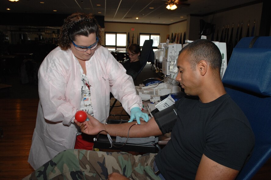 DYESS AIR FORCE BASE, Texas -- Mary Davidson,  Abilene’s Meek Blood Center blood bank technician, draws blood from Staff Sgt. Angel Rodriguez, 7th Maintenance Operations Squadron, during an on-base blood drive here Sept. 24. The Meek Blood Center supplies blood to 15 hospitals and medical facilities in a 12-county area. The base is currently trying to hold blood drives every eight weeks with the support of sponsors. Approximately 40,000 units of red cells are needed each day. For more information on donating blood, contact the center at 670-2798 or go to their Web site: www.meekbloodcenter.org. (U.S. Air Force photo by Staff Sgt. Connor Estes)