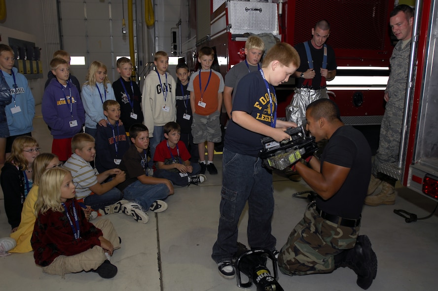 MINOT AIR FORCE BASE, N.D. -- STARBASE students tour the 5th Civil Engineer Squadron fire protection flight here recently as part of the year-long educational program. Touring mission-essential components on Minot AFB is just one of many activities the students participate in under the Department of Defense-funded initiative. This marks the first year STARBASE is implemented here. (U.S. Air Force photo by Airman 1st Class Jesse Lopez)