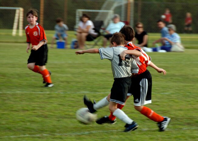 Ryan Schwein, number 15, and Michael Shetz, number 10, fight for possession of the ball during the second quarter at the base soccer field Sept. 22. The Hanahan Starz defeated the Silver Bullets 2-1. (U.S. Air Force photo/Airman 1st Class Timothy Taylor)