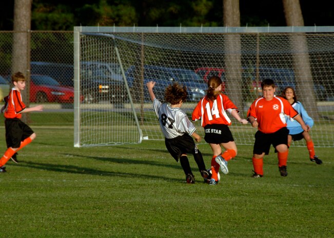 Alex Hammond, number 87, takes a shot at the goal during the first quarter of the game at the base soccer field Sept. 22. The Hanahan Starz defeated the Silver Bullets 2-1. (U.S. Air Force photo/Airman 1st Class Timothy Taylor)