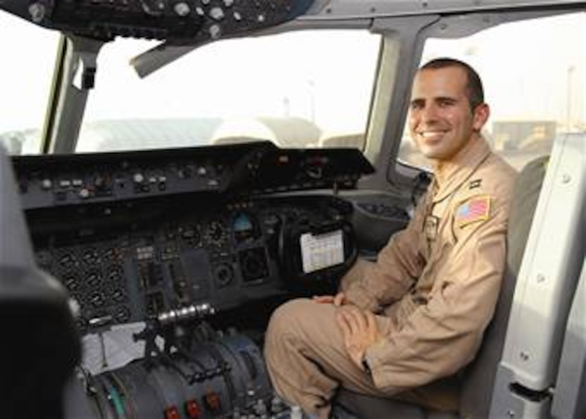 Capt. Jason Moraes prepares to head out on a mission in a KC-10 Extender Sept. 17 from an air base in Southwest Asia. He was recently reunited with his brother at 20,000 feet over Afghanistan during a combat sortie Sept. 10. The brothers had been apart for a year when they met in the sky for the 10-minute reunion. Captain Moraes is a KC-10 pilot for the 908th Expeditionary Air Refueling Squadron. (U.S. Air Force photo/Tech. Sgt. Denise Johnson) 
