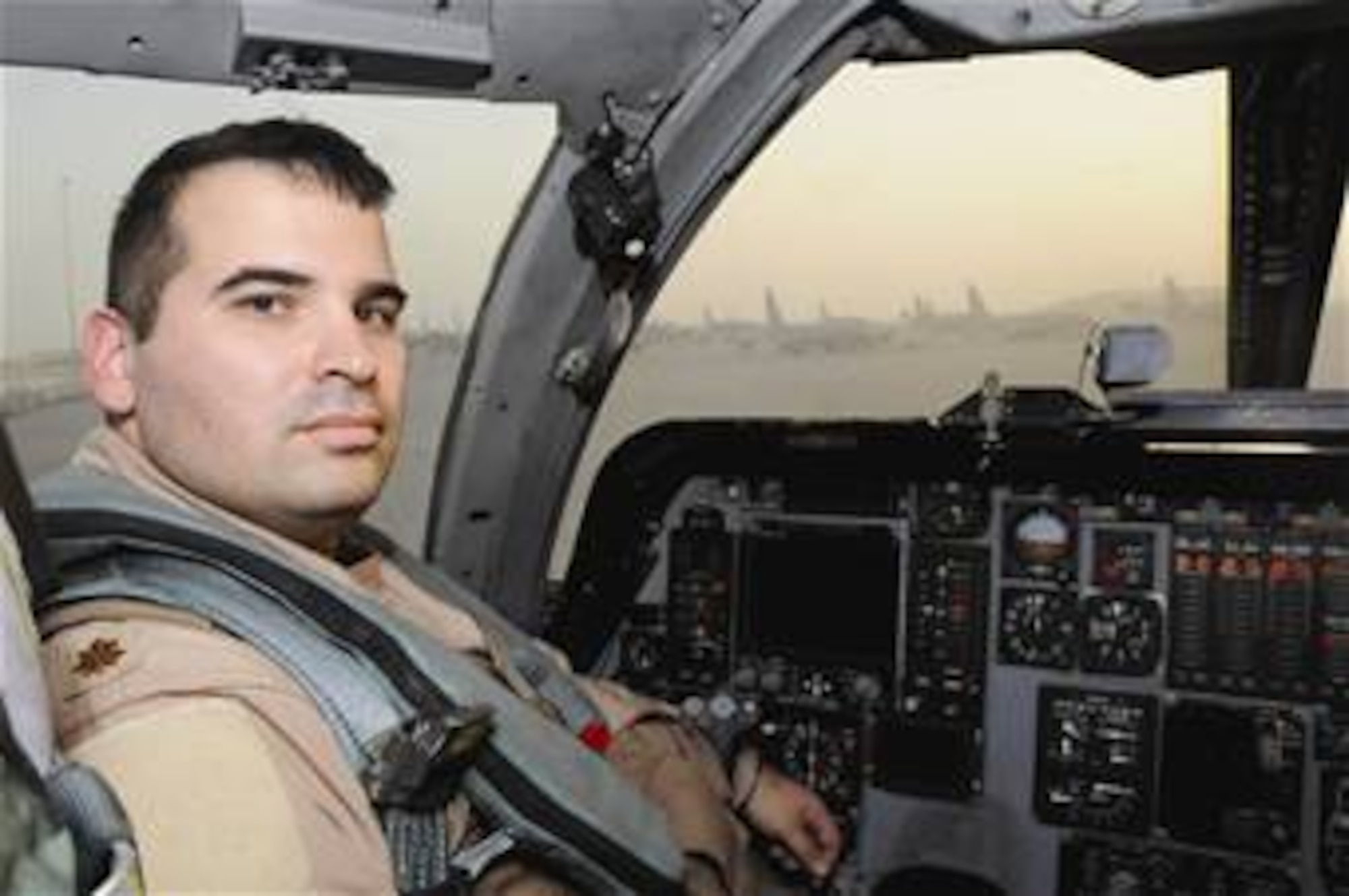 Maj. Eric Moraes sits in the cockpit of a B-1B Lancer Sept. 16 at a Southwest Asia air base. Major Moraes was recently reunited with his brother at 20,000 feet over Afghanistan during a combat sortie Sept. 10. The brothers had been apart for a year when they met in the sky for the 10-minute reunion. Major Moraes is a B-1B pilot for the 379th Air Expeditionary Wing. (U.S. Air Force photo/Staff Sgt. Darnell Cannady) 

