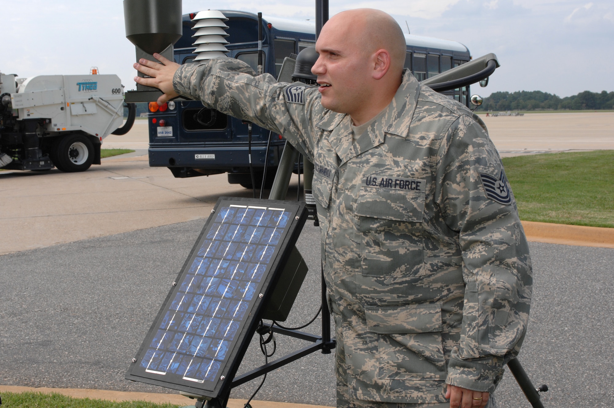 LANGLEY AIR FORCE BASE, Va. -- Tech. Sgt.  Michael Mazucci-Mambala, Operations Support Group weather forecaster, explains how the Tactical Meteorological Observing System (TMQ53)  works Sept.9. Even with today’s modern equipment, Langley pilots are still subject to weather observers giving the go-ahead before aerial sorties can be accomplished. (U.S. Air Force photo/Tech. Sgt. April Wickes) 
