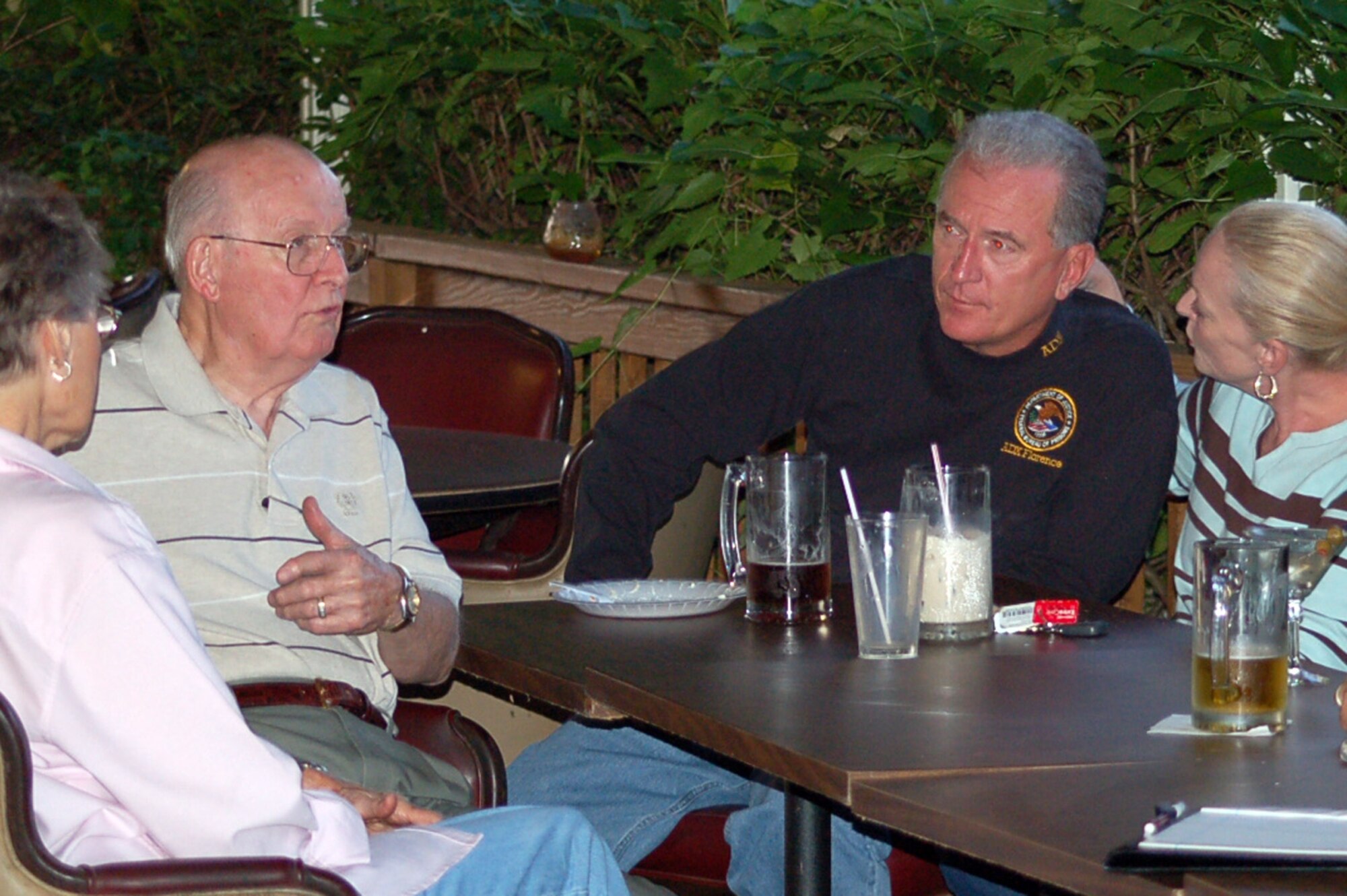 Texas Air National Guard Colonel George Sharp and his wife, Jan, visit with Col. Stuart Maberry, Eighth Air Force director of intelligence and his wife, Eva, during the Wednesday night “Guard-b-cue” at Hangar II Sept. 17. The cookout, which takes place every Wednesday, is an opportunity for those on temporary duty at Barksdale to get together with other members of the base in a sort of “home-away-from-home” atmosphere. (U.S. Air Force photo by Carla A. Pampe)

