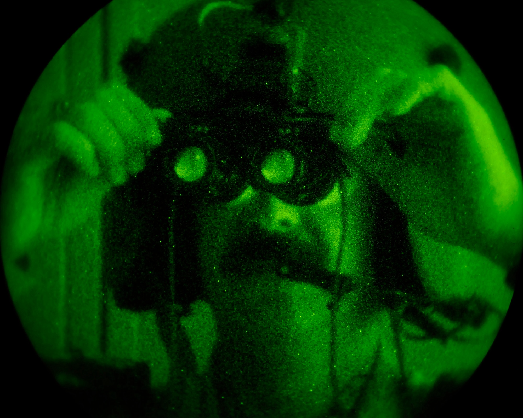 Iraqi Air Force Lt. Col. Ahmed M. Thwinee adjusts his night vision goggles before a training flight from Taji Air Base, Iraq, Sept. 11. Thwinee is second commander and an instructor pilot with the Iraqi air force's 15th Squadron. American Airmen with the 770th Air Expeditionary Advisory Squadron accompanied the Iraqi aircrew on the flight. (U.S. Air Force photo/Staff Sgt. Paul Villanueva II)