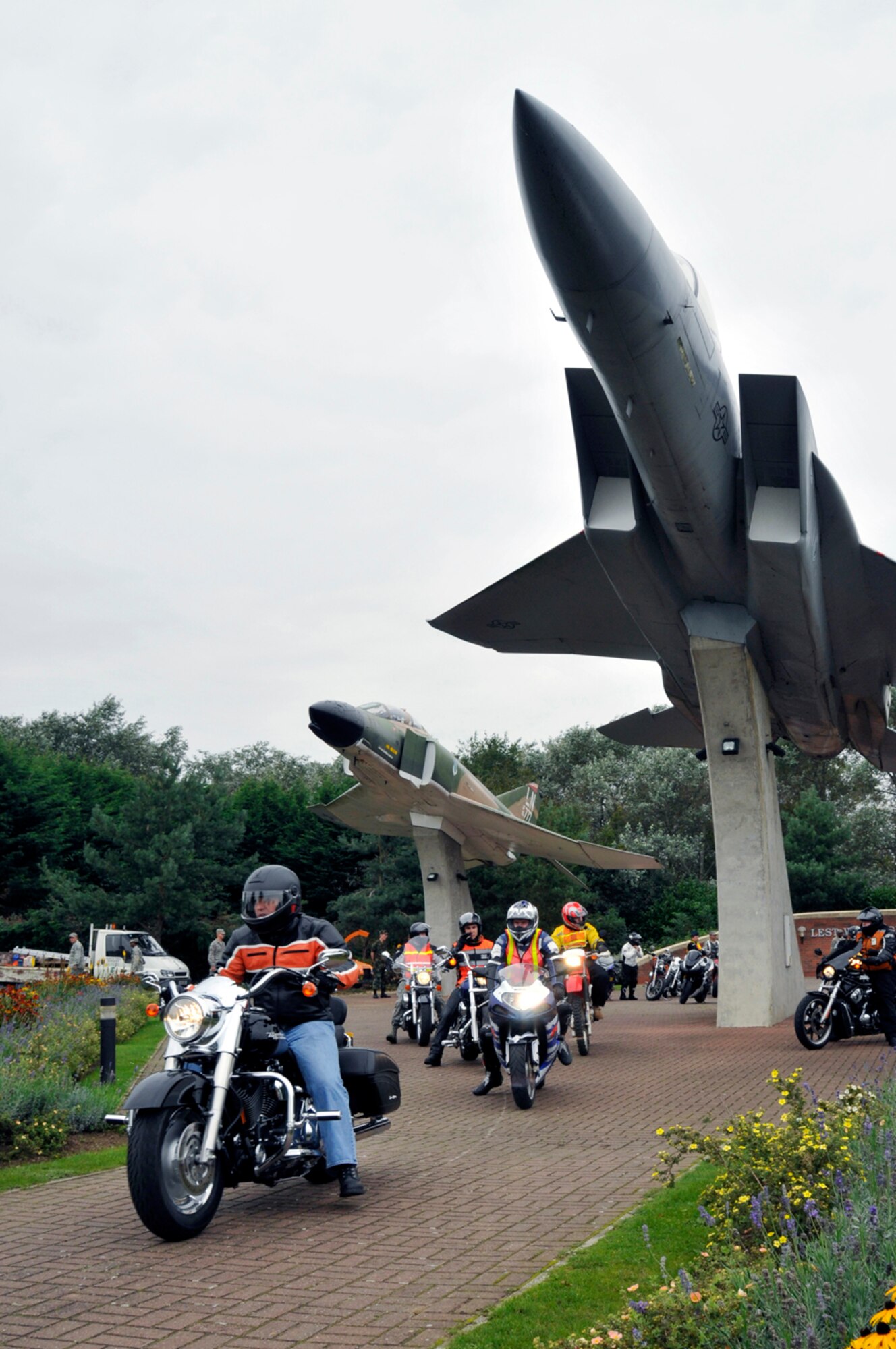 Airmen From RAF Lakenheath, RAF Mildenhall and RAF Feltwell depart from the Lest We Forget Memorial and Air Park Sept. 16 at RAF Lakenheath, England. The riders participated in a memorial motorcycle ride to observe National Prisoner of War and Missing in Action Remembrance Week Sept. 15 to 19. (U.S. Air Force photo by Airman Perry Aston)