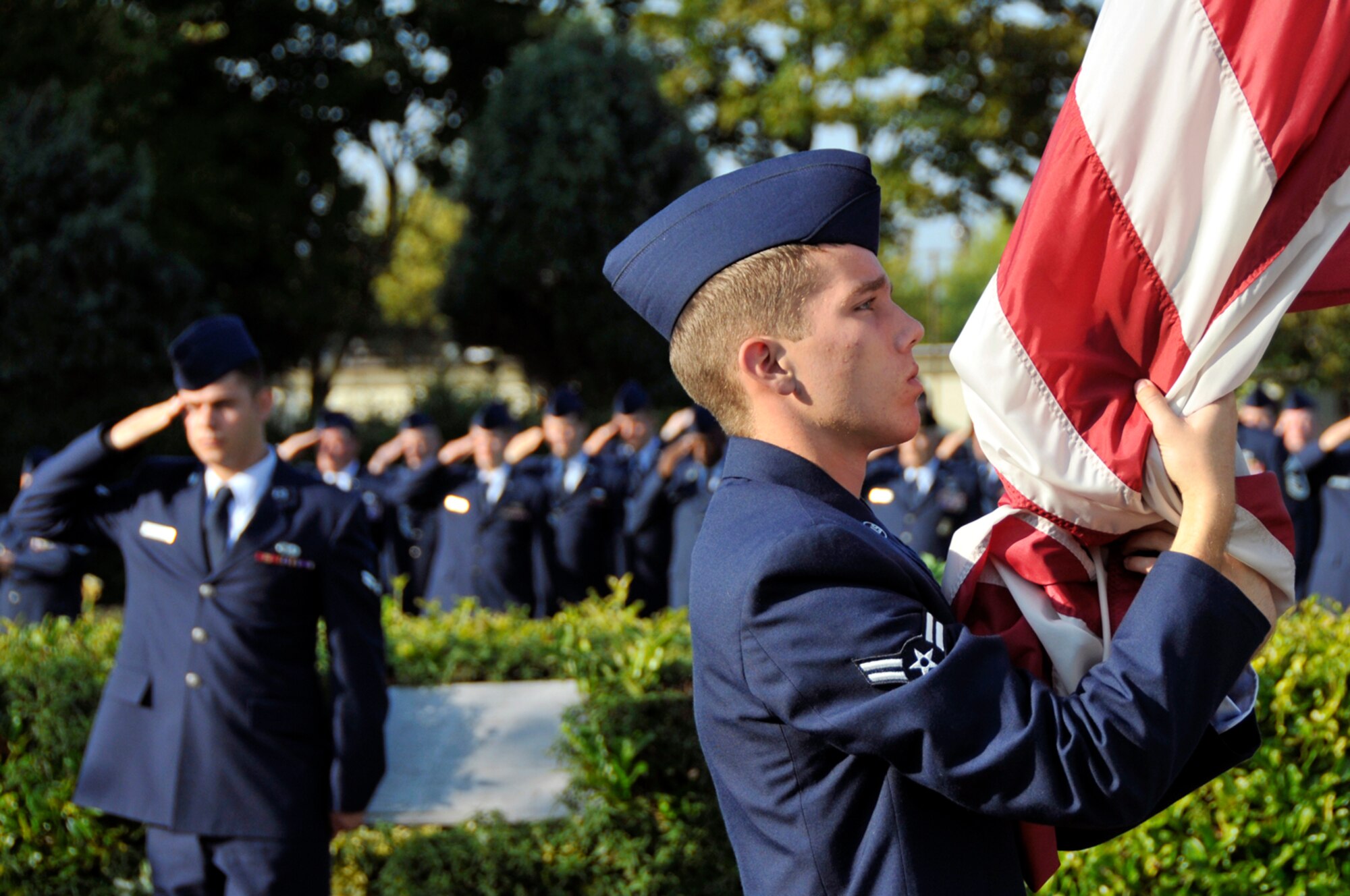 First Term Airmen perform Retreat Sept. 19 at RAF Lakenheath, England. Airmen from different squadrons of the 48th Fighter Wing stood in formation as a part of the closing ceremony for National Prisoner of War and Missing in Action Remembrance Week. (U.S. Air Force photo by Airman 1st Class Perry Aston)