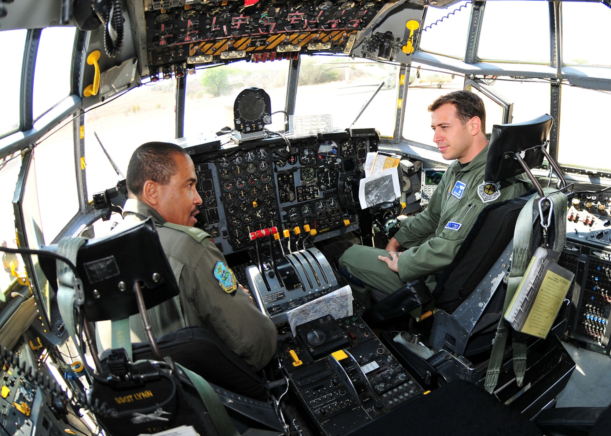 United States Air Force Capt. Daniel Santoro, 37th Airlift Squadron C-130 pilot, talks to Maj. T. Phuthego, Botswana Defense Force chief C-130 pilot. (U.S. Air Force photo by Staff Sgt. Marcus Maier)(Released)