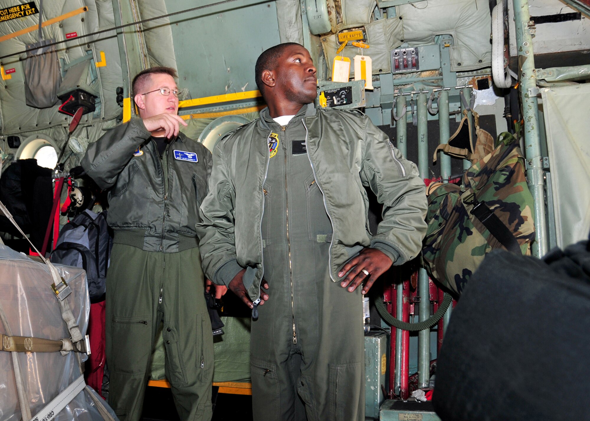 Master Sgt. Alex Garret, 37th Airlift Squadron C-130 flight engineer shows Warrant Officer 1st Class Malefho Baipusi, Botswana Defense Force C-130 flight engineer, the inside of a U.S. C-130. (U.S. Air Force photo by Staff Sgt. Marcus Maier)(Released)