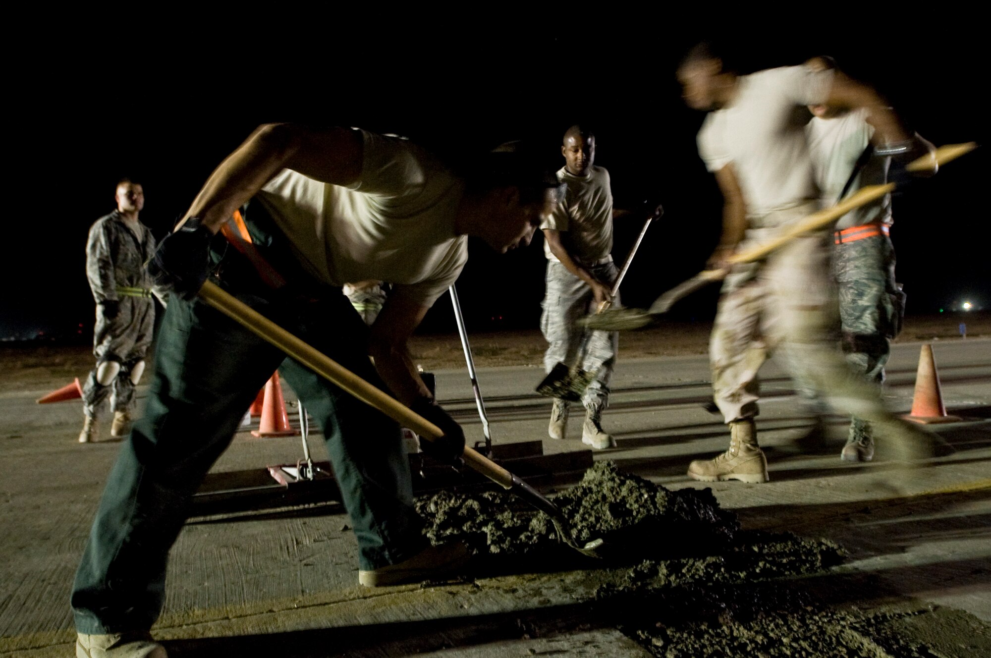 ALI BASE, Iraq -- Airmen of the 407th Expeditionary Civil Engineer Squadron, repair the runway here Sept. 22, 2008. Extreme heat conditions, along with normal wear and tear, can cause cracks or pot holes on the runways, which makes it unsafe for aircraft. Airmen of the 407th ECES ensure the flight line is serviceable at all times by fixing any reported damage.  (U.S. Air Force photo/Airman 1st Class Christopher Griffin)