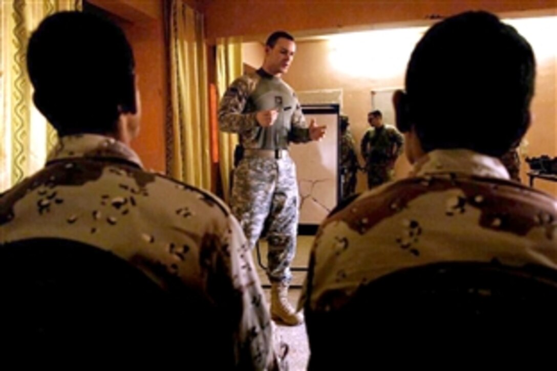 U.S. Army Staff Sgt. Aaron Shepherd teaches Iraqi soldiers checkpoint procedures inside a building on Forward Operating Base Hawk, Iraq, Sept. 18, 2008. Shepherd and other soldiers are assigned to the 4th Infantry Division's Troop C, 4th Squadron, 10th Cavalry Regiment. 
