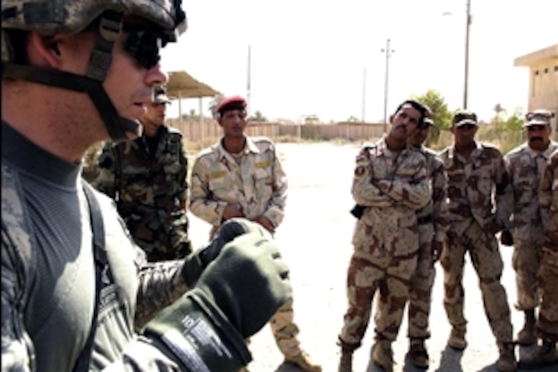 U.S. Army Staff Sgt. Aaron Shepherd instructs Iraqi soldiers on proper checkpoint procedures on Forward Operating Base Hawk, Iraq on Sep. 18, 2008. Shepherd is assigned to the 4th Infantry Division's, 4th Squadron, 10th Cavalry Regiment. 