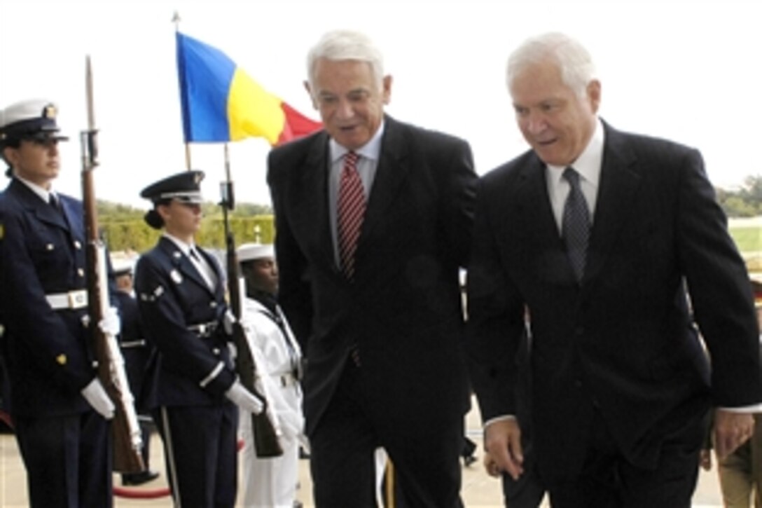 U.S. Defense Secretary Robert M. Gates, right, escorts Romanian Minister of Defense Teodor Melescanu through an honor cordon into the Pentagon Sept. 24, 2008, to talk about bilateral defense issues. 