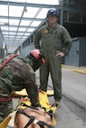 Navy Petty Officer 2nd Class, Kevin McCaughtry (right), hospital corpsman, Headquarters and Service Company, Chemical Biological Incident Response Force, II Marine Expeditionary Force, responded to Sept. 11, 2001 as a civilian emergency medical technician. Now, he is in charge of developing medical curriculum for the CBIRF Basic Operations Course.