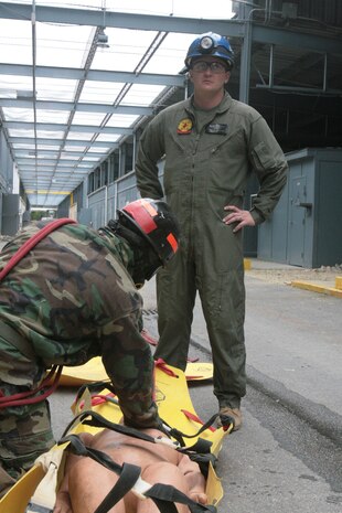 Navy Petty Officer 2nd Class, Kevin McCaughtry (right), hospital corpsman, Headquarters and Service Company, Chemical Biological Incident Response Force, II Marine Expeditionary Force, responded to Sept. 11, 2001 as a civilian emergency medical technician. Now, he is in charge of developing medical curriculum for the CBIRF Basic Operations Course.