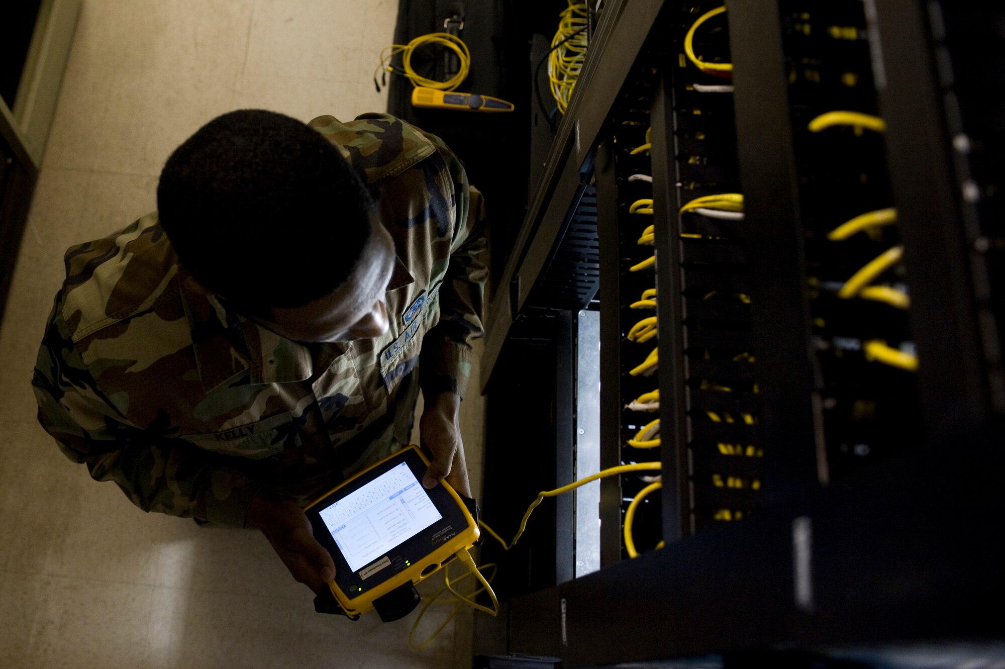 Senior Airman Lloyd Kelly,  354th Communication Squadron, uses a fluke ether scope series II to test the connectivity of ports on the base network system Sep. 24, 2008, at Eielson Air Force Base, Alaska. Airman Kelly is an infrastructure technician at the network control center which is the nerve center of base e-mail, internet access and shared drives.  (U.S. Air Force photo/Airman 1st Class Jonathan Snyder) 