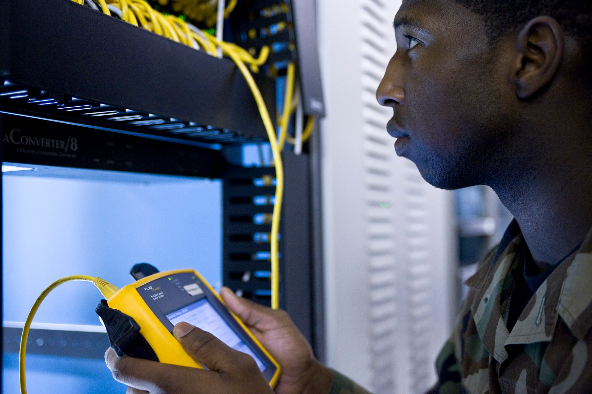 Senior Airman Lloyd Kelly,  354th Communication Squadron, uses a fluke ether scope series II to test the connectivity of ports on the base network system Sep. 24, 2008, at Eielson Air Force Base, Alaska. Airman Kelly is an infrastructure technician at the network control center which is the nerve center of base e-mail, internet access and shared drives.  (U.S. Air Force photo/Airman 1st Class Jonathan Snyder) 