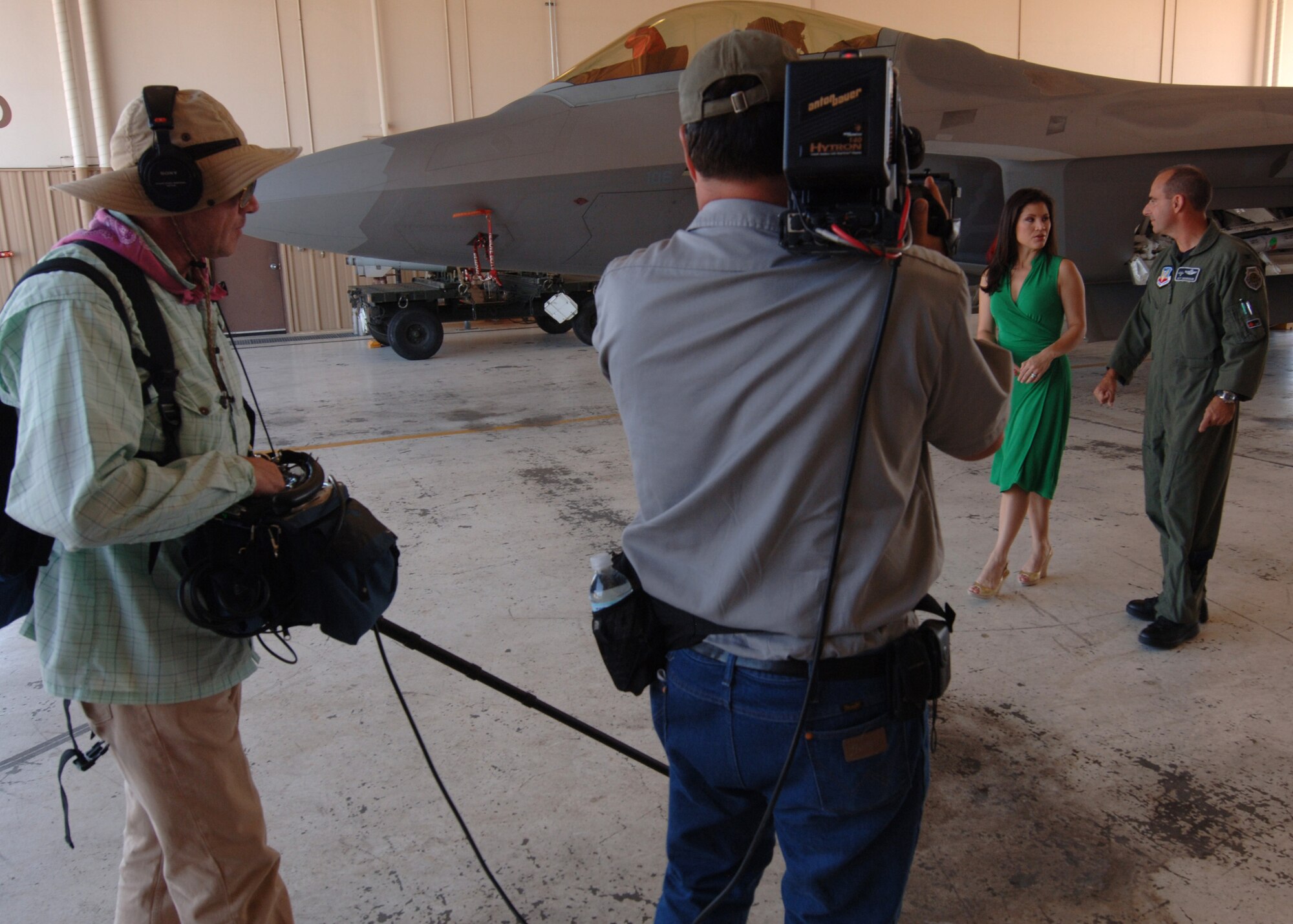"The Insider"'s Victoria Recano does a walk around of the F-22A with Col. Jeff Harrigian, 49th Fighter Wing commander, September 19 at Holloman Air Force Base, N.M. "The Insider" was given access to director Michael Bay's "Transformers: Revenge of the Fallen" while filming at Holloman and White Sands Missile Range.  (U.S. Air Force photo/Airman 1st Class Michael Means)