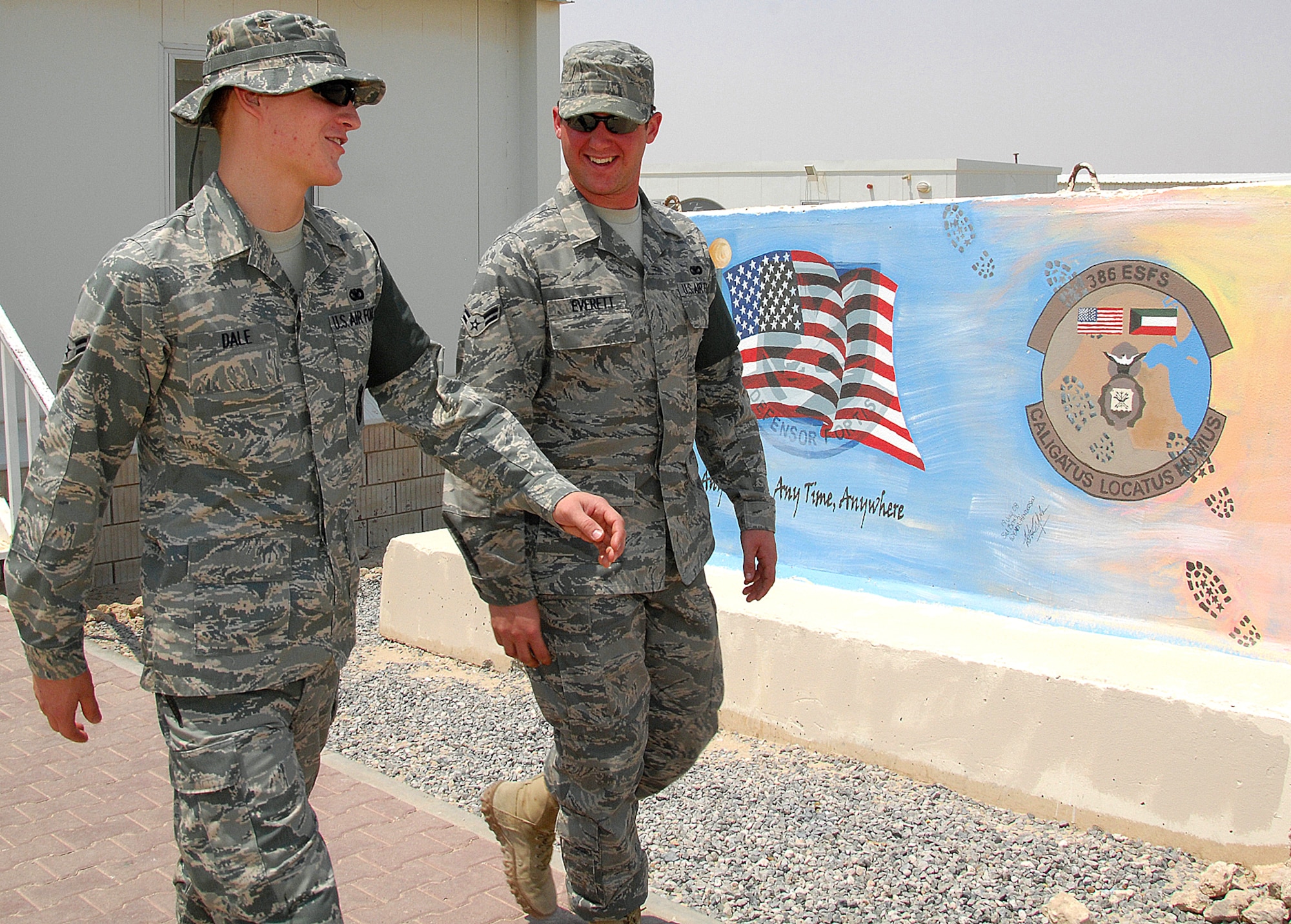 Airmen 1st Class William Dale, left, and Thomas Everett  talk about how quick thinking avoided a tragic incident Aug. 26 at an air base in Southwest Asia. During a cargo mission in early August, Airman Everett saved Airman Dale from hypoxia and possible brain damage from oxygen deprivation. Airman Everett has been nominated for the Airman's Medal for his efforts. Both Airmen are deployed from Nellis Air Force Base, Nev., and are assigned to the 386th Expeditionary Security Forces Squadron. (U.S. Air Force photo/Tech. Sgt. Raheem Moore)