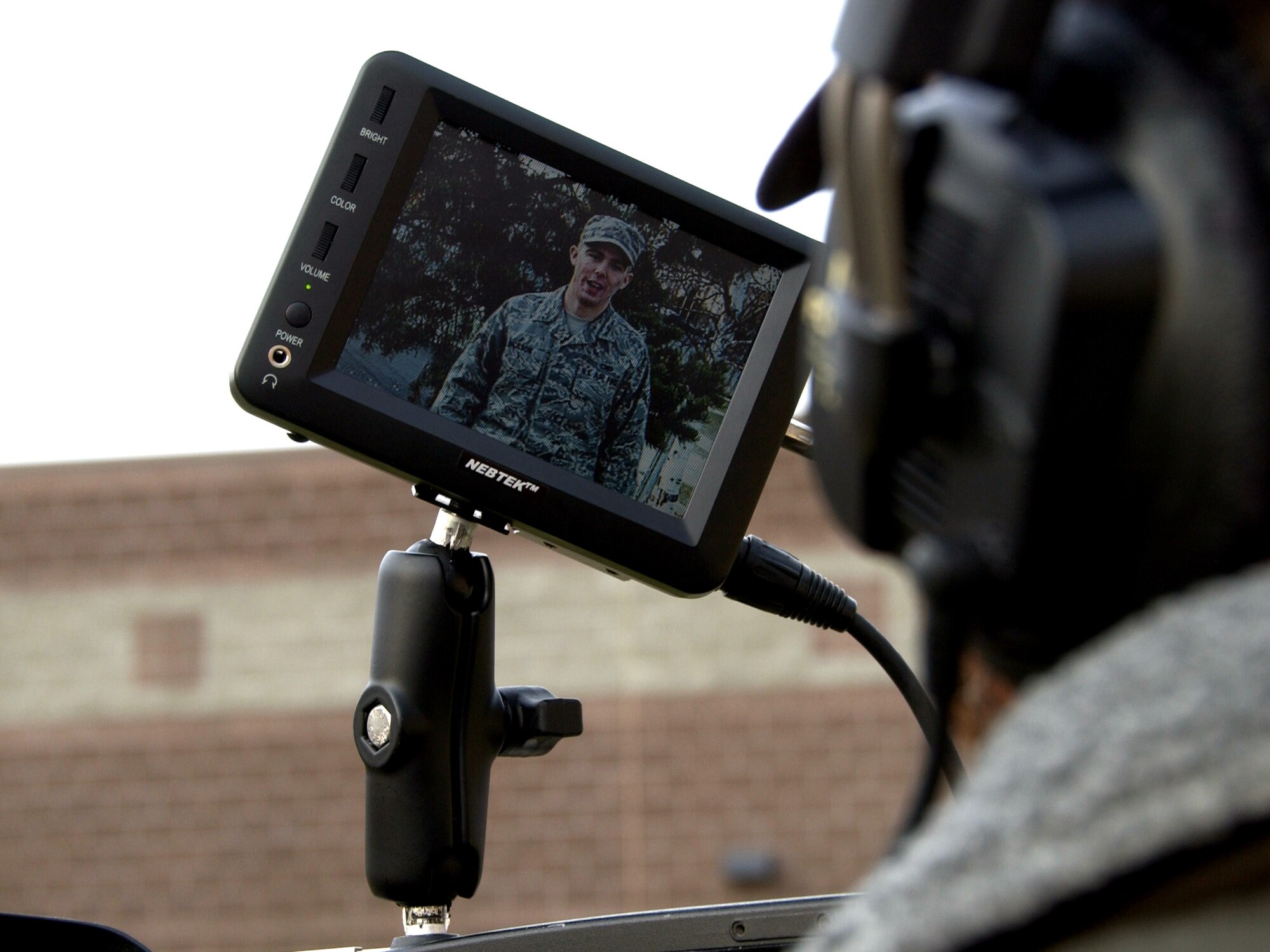 Mr. Erich Schwab video tapes Airman David Dickson?s holiday greeting to family and friends from Eielson AFB, AK on September 24, 2008. The hometown holiday greetings program allows servicemembers stationed overseas to sends messages back to the home so family and friends can see and hear them on local television and radio stations. ( U.S. Air Force photo by Airman Laura Max)                               