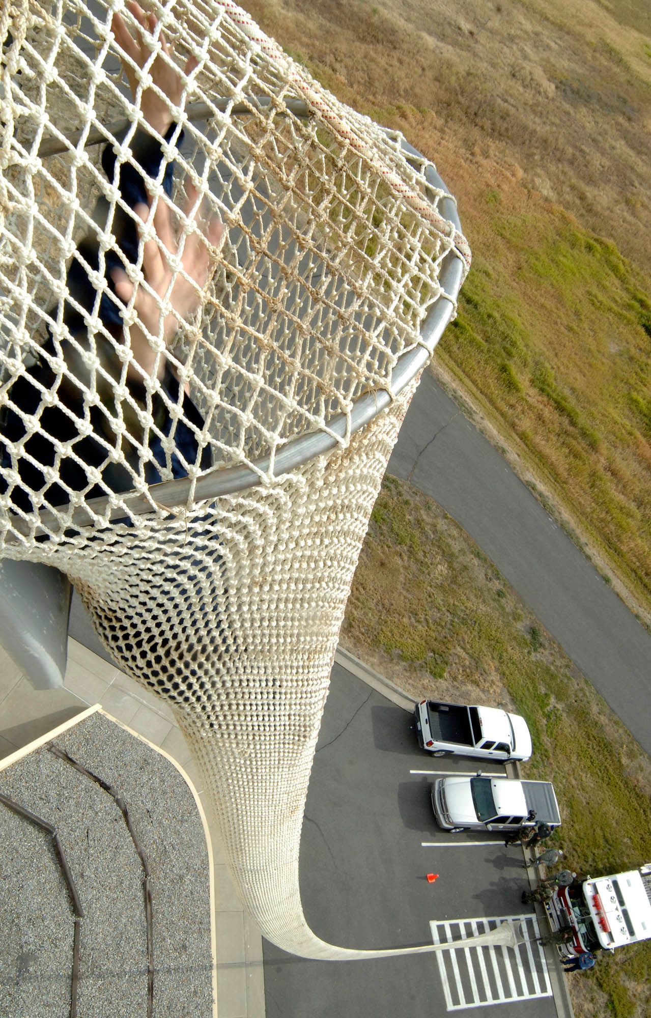 FAIRCHILD AIR FORCE BASE, Wash. – Staff Sgt. Julie Chilton, 92nd Operations Support Squadron, slides down the life chute Sept. 24. This training is done annually to practice egress procedures from Fairchild’s Air Traffic Control Tower. (U.S. Air Force photo / Staff Sgt. JT May III)

