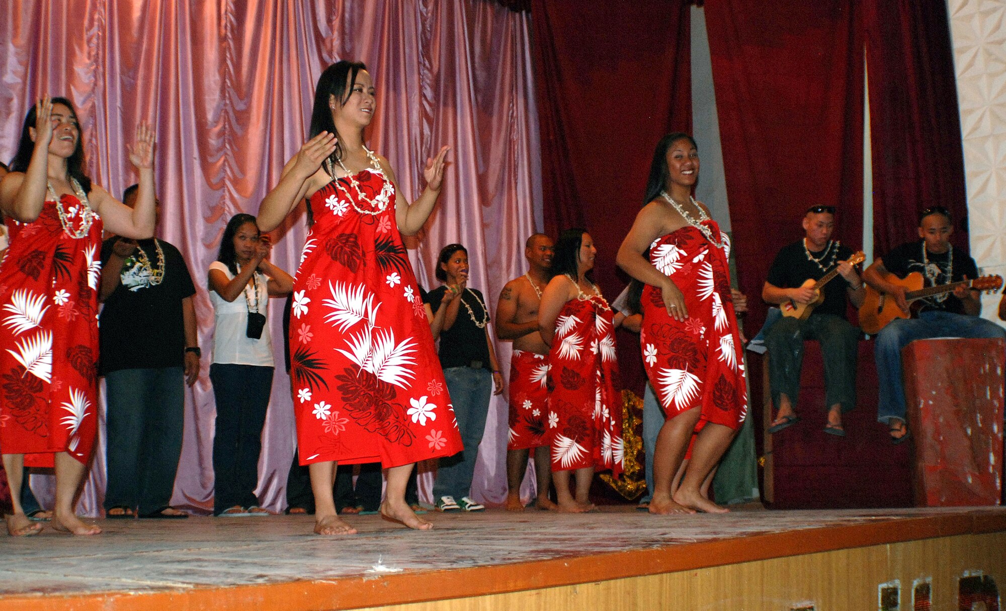 Airmen from Manas Air Base, Kyrgyz Republic, share traditional Pacific Island songs and dances with a group of more than 100 Kyrgyz children during the Pacific Island Cultural Day of Sharing Aug. 20 in the village of Jeny Pahkta. Members of the 376th Air Expeditionary Force Support Squadron has sponsored the Kyrygz village for six years, donating clothes and painting and cleaning the local school. (U.S. Air Force photo/Senior Airman Alison Osborn) 